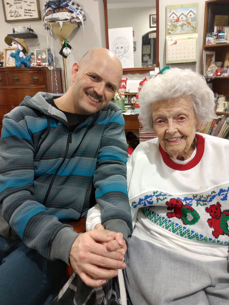 Sgt. Patrick Demers sitting next to his nearly 104-year-old grandmother, Luella Demers.