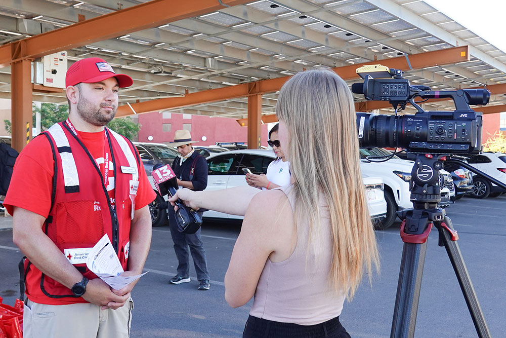 Scott Salzer being interviewed by a news reporter.