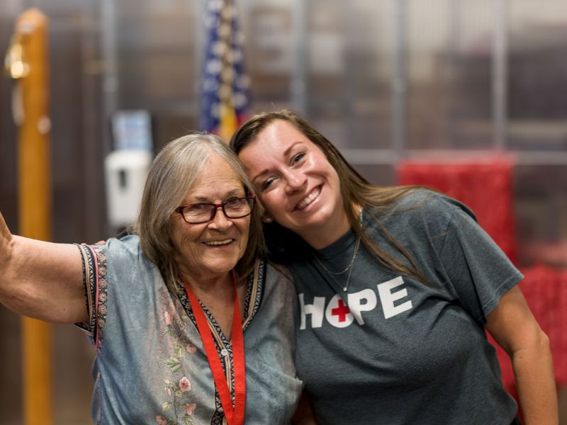 courtney smiling and embracing red crosser.