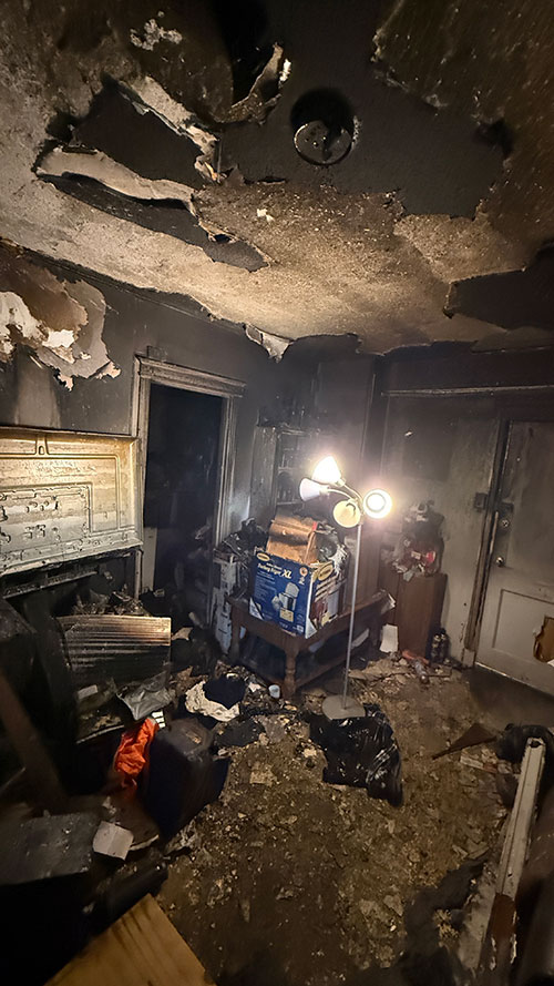 the inside the room of a burned and damaged apartment.