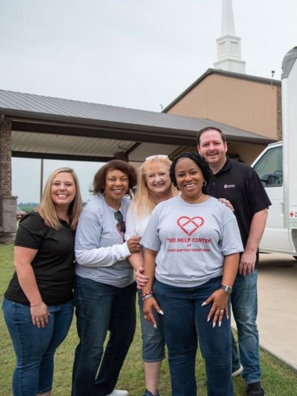 volunteers outside of help center.