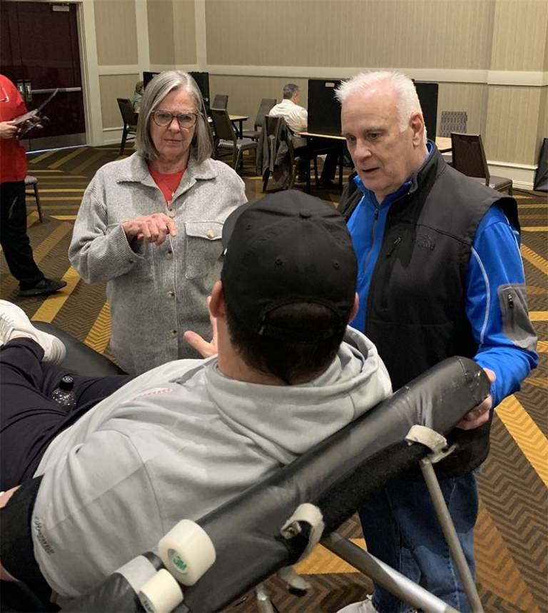 Mark and Ann Richards talk to a donor at the annual Red Cross blood drive