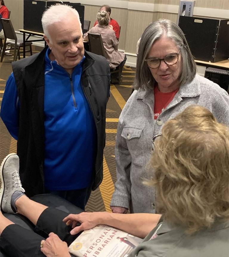 Mark and Ann Richards talk to a donor at the annual Red Cross blood drive