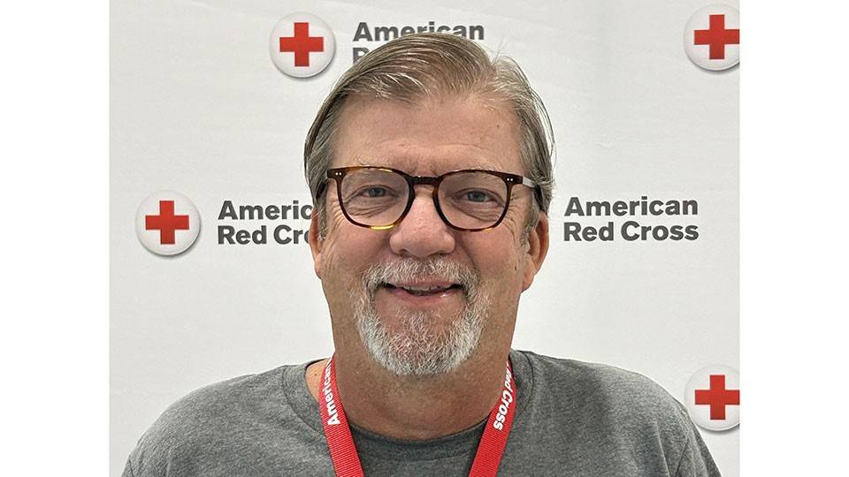 headshot of volunteer Mike McGowan in a Red Cross shirt.