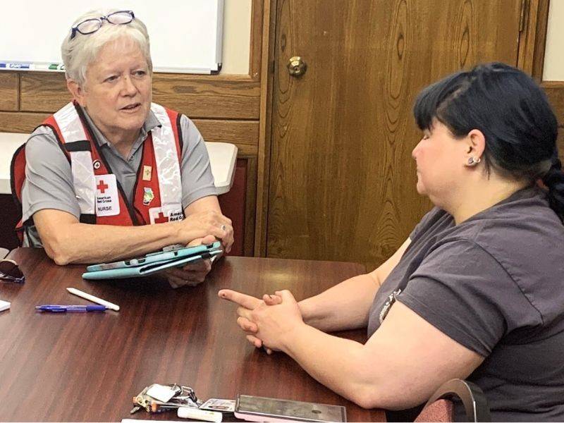 patsy speaking with red cross volunteer