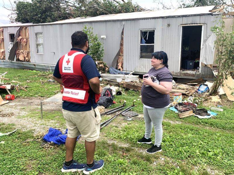 resident talking to volunteer