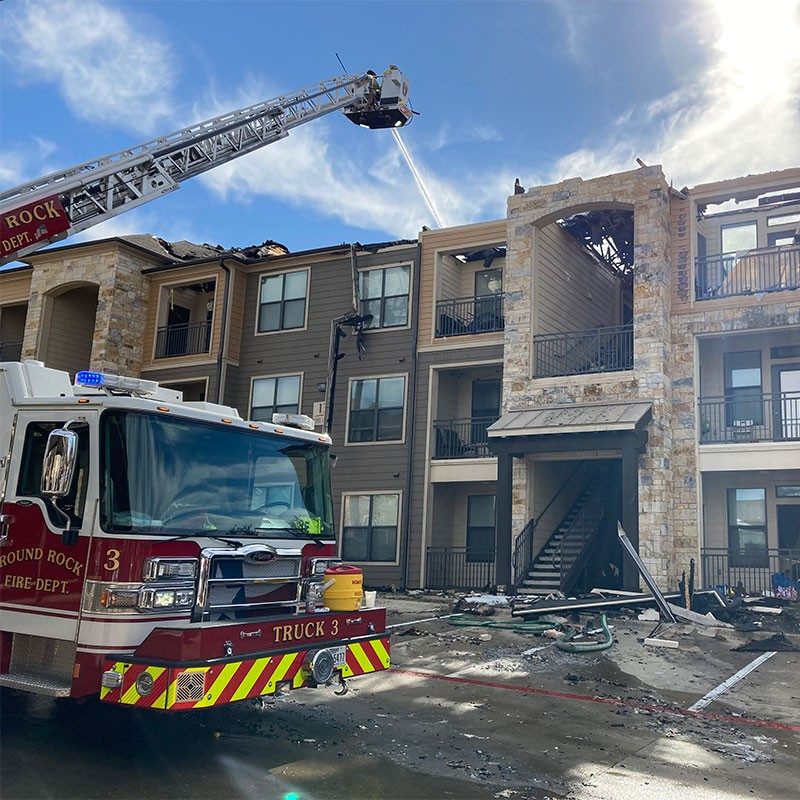 Fire truck extinguishing apartment fire.