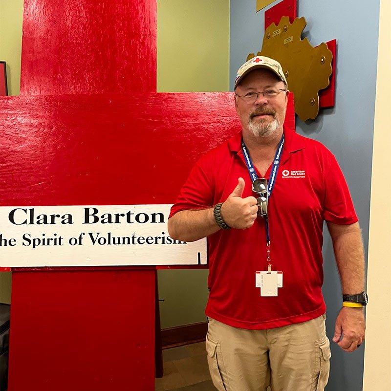 Red Cross volunteer Steve Wheeler giving thumbs up.