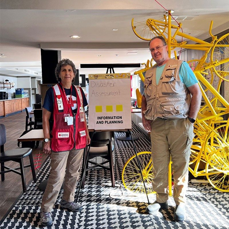 Volunteers Lucy Medina and Ralph Lipps.