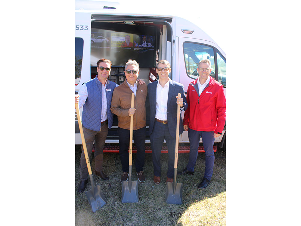 Javier Valdez and three other people stand with shovels at a Groundbreaking event