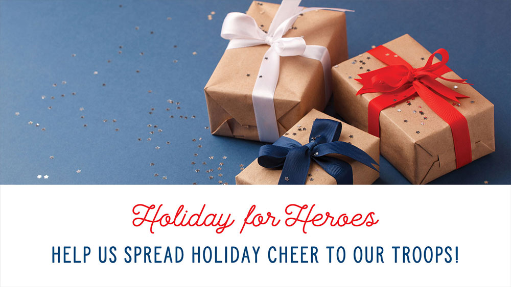 Holiday for Heroes banner with presents wrapped in brown paper and colorful bows.