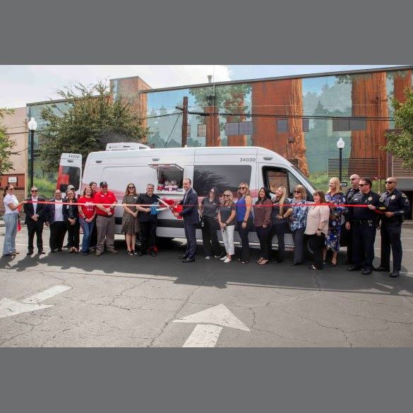 Ribbon cutting ceremony for new emergency response vehicle.