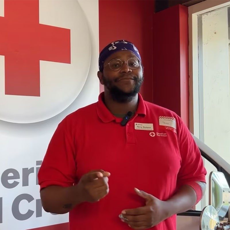 Terry Dotson wearing Red Cross shirt.