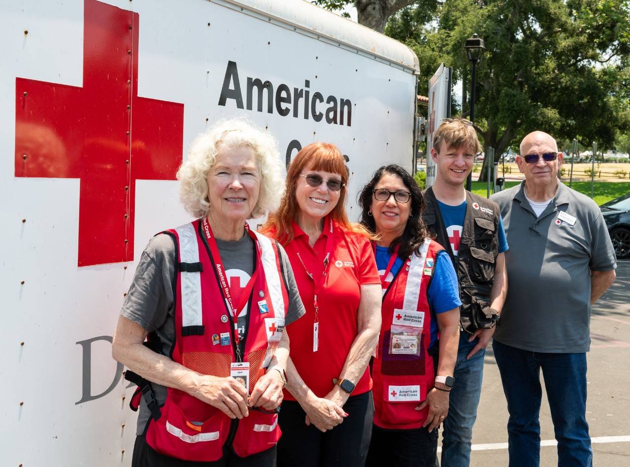 group of central california red cross volunteers in front of disaster response vehicle