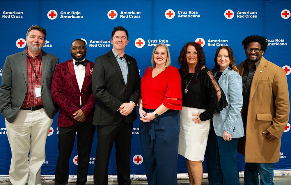 group photo of the eight central valley chapter board of directors at a Red Cross event.