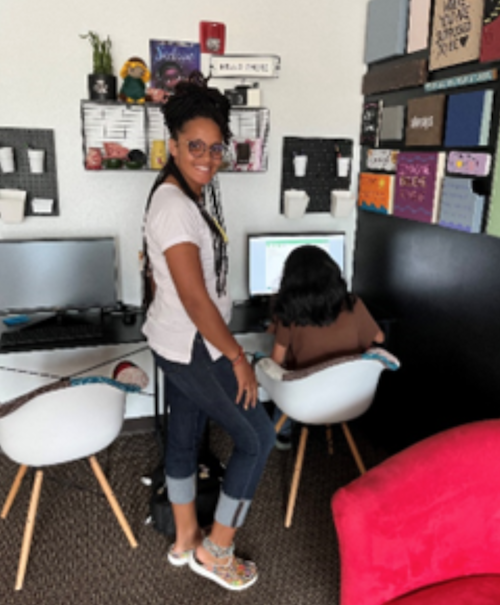 Margie Pierrelouis working with one of her students who is struggling in math. 