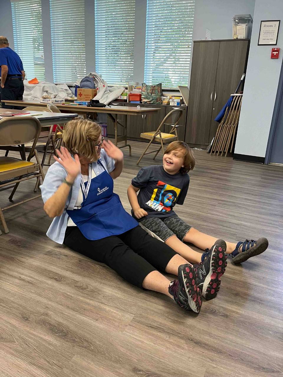 Linda exercises with one of the children at CDS. 