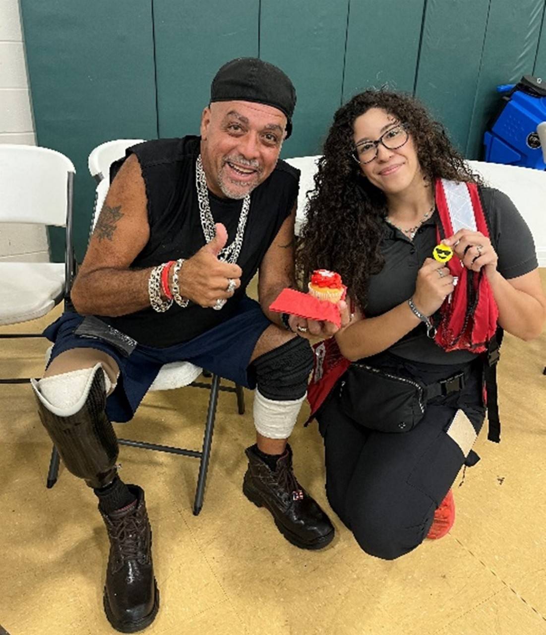 steve surillo holding thumbs up with red crosser