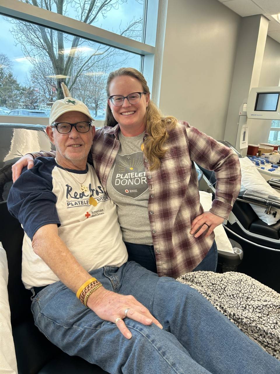 Emily Brown and John Stout giving blood
