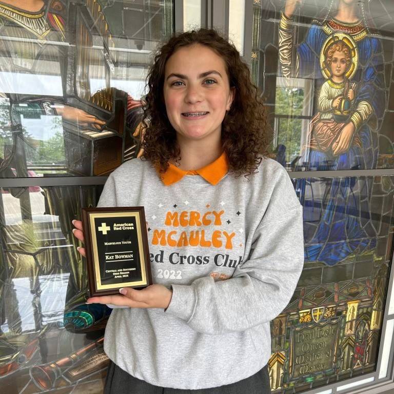 Mercy McAuley High School student Kat Bowman and award.