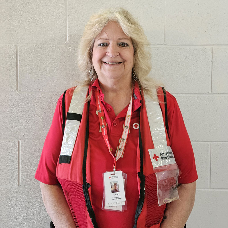 Robin Burmeister in a Red Cross volunteer uniform.