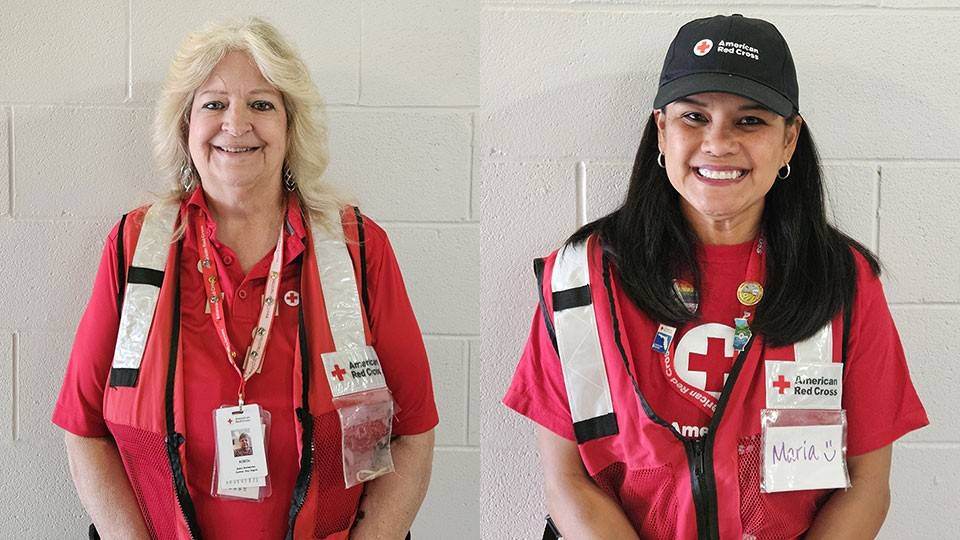Robin Burmeister and Maria Erickson in a Red Cross volunteer uniform.