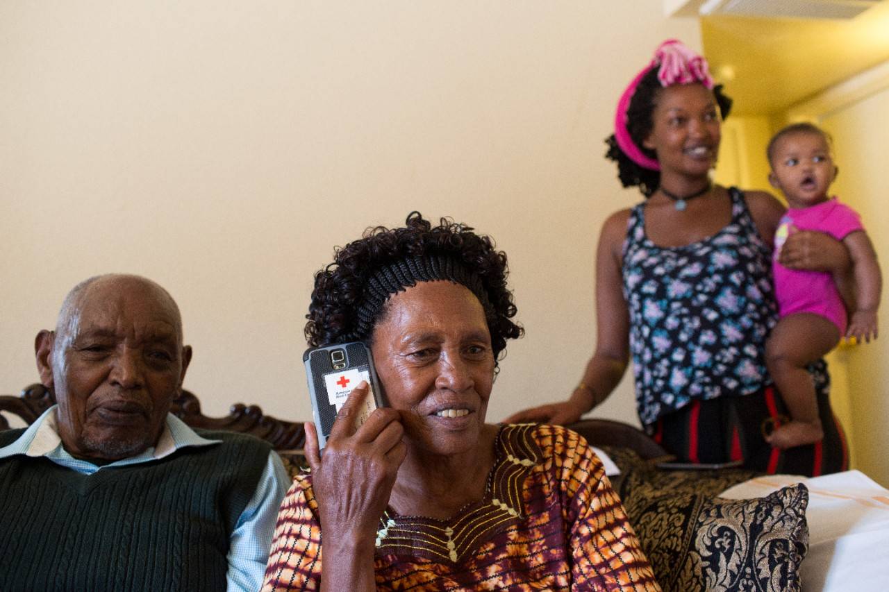 June 12, 2018.  Phoenix, Arizona. American Red Cross’s Restoring Family Links (RFL) program helps reconnect family members separated internationally by disasters, war, conflict, migration, and other crises. The services are free and confidential.
Rahel uses a Red Cross-sponsored phone to call a loved one she reconnected with through the Restoring Family Links (RFL) program.
Photo by Michelle Frankfurter/American Red Cross