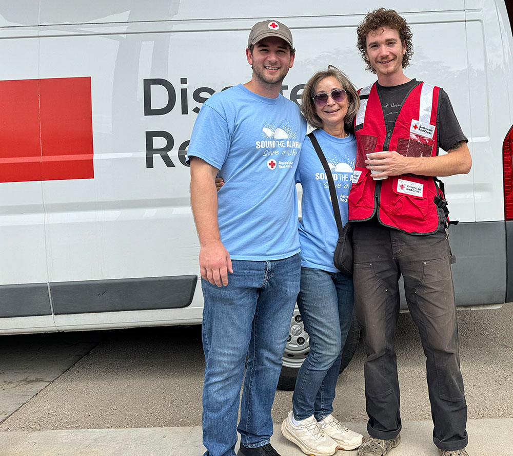 Benton, his mom Pam and a Red Cross of Northern Colorado volunteer group pic in front of a Red Cross van.