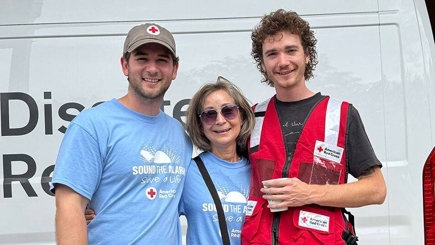 Benton, his mom Pam and a Red Cross of Northern Colorado volunteer group pic in front of a Red Cross van.