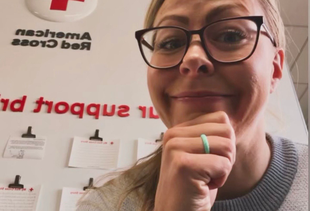 Woman looking at a camera with the words "I donated blood" above her and info below her on donating at the Red Cross headquarters in Denver