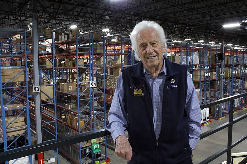 A man stands in a warehouse