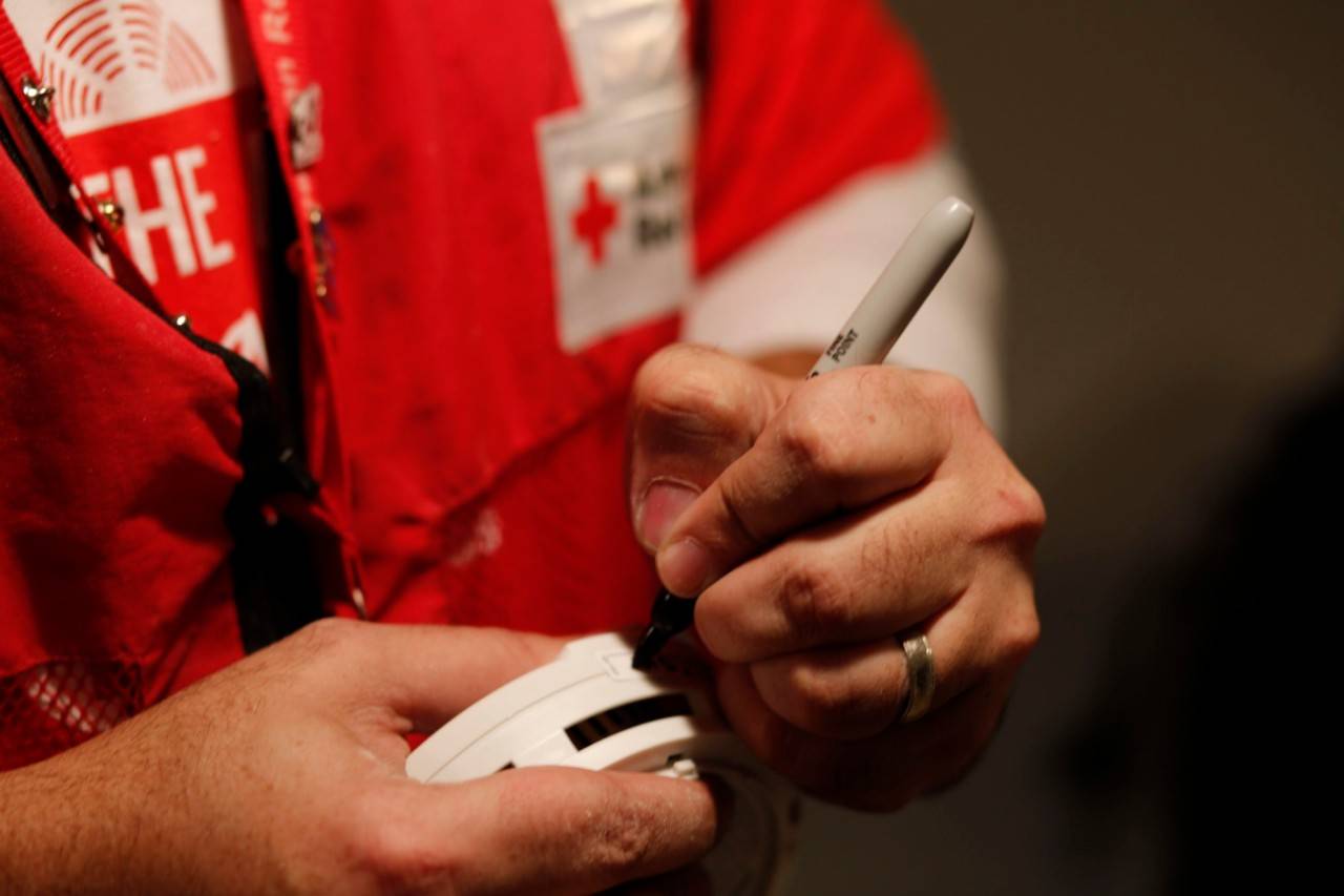 May 10, 2018
St. Paul, Minnesota.
Smoke alarm installation during the Sound the Alarm event.
Pictured: Marking the date on smoke alarms

An American Red Cross volunteer marks the date on a new smoke alarm just before installing it in a St. Paul, Minnesota home during a  Sound the Alarm  event. 

"Sound the Alarm" is a national campaign to raise awareness about the deadly dangers of home fires. Volunteers canvas neighborhoods across the country to provide free smoke alarms and installation for any home that needs them. During a home visit some team members install the alarms while others inform the residents about how to prevent fires in the home. They also help residents design an escape plan which shows the best ways to exit the home in the event of a fire.

All smoke alarms, installations and educational materials are provided to residents, free-of-charge, by the American Red Cross and their corporate and community partners.

Photo by Andy Clayton-King for the American Red Cross.