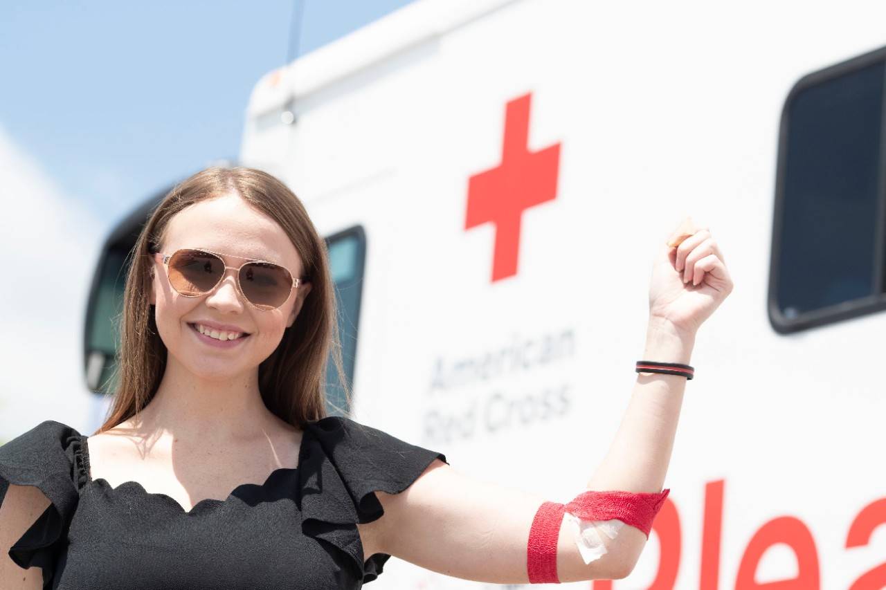 June 26, 2018.Columbia, South Carolina. Bloodmobile.Pictured: Blood donor Kimberly McCawAmerican Red Cross donor Kimberly McCaw celebrates making another successful blood donation during the dedication of a new bloodmobile in Columbia, South Carolina. The vehicle was generously donated by local businesses and American Red Cross Tiffany Circle members. Central SC Board of Directors member Keith Hudson led the charge to add another Bloodmobile to the fleet after learning about the positive impact bloodmobiles have had on blood collection. Executives from Mungo Homes and Southeastern Freight Lines helped fund the new Columbia, South Carolina Bloodmobile. Tiffany Circle members Charlotte Berry and Cheryl Holland also made contributions, as well as the Lexington Medical Center. Photo by Jason Miczek for the American Red Cross.