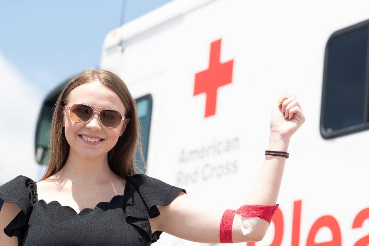 June 26, 2018.
Columbia, South Carolina. 
Bloodmobile.
Pictured: Blood donor Kimberly McCaw

American Red Cross donor Kimberly McCaw celebrates making another successful blood donation during the dedication of a new bloodmobile in Columbia, South Carolina. 

The vehicle was generously donated by local businesses and American Red Cross Tiffany Circle members. Central SC Board of Directors member Keith Hudson led the charge to add another Bloodmobile to the fleet after learning about the positive impact bloodmobiles have had on blood collection. Executives from Mungo Homes and Southeastern Freight Lines helped fund the new Columbia, South Carolina Bloodmobile. Tiffany Circle members Charlotte Berry and Cheryl Holland also made contributions, as well as the Lexington Medical Center. 

Photo by Jason Miczek for the American Red Cross.