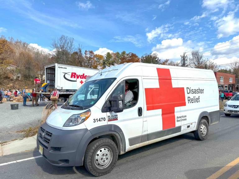 Maekala Mims arrives on a truck full of supplies