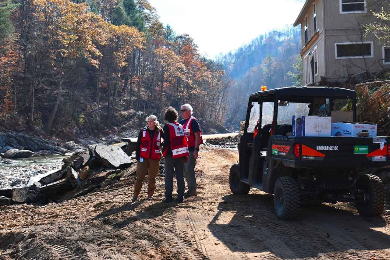 Red Cross volunteers observe damage destroyed by Hurricane Helen