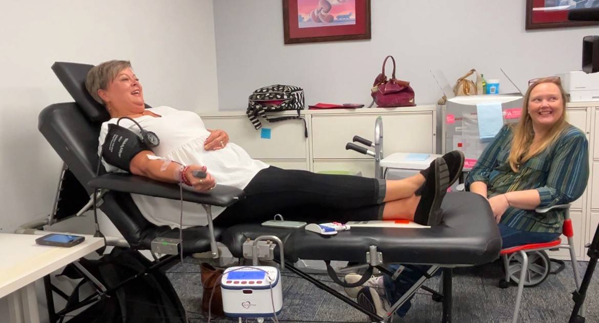 Blood buddies support each other while donating