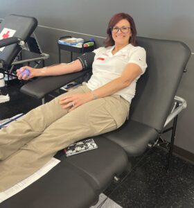 Orkin’s Dawn Aguayo donates blood at a recent drive.