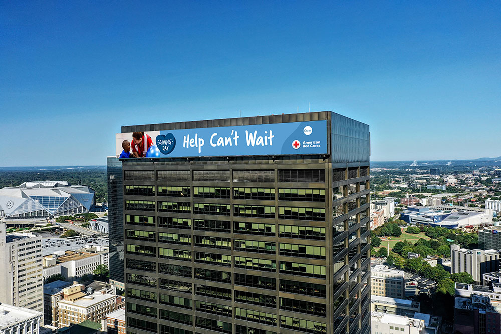 Help Can't Wait banner on top of tall building