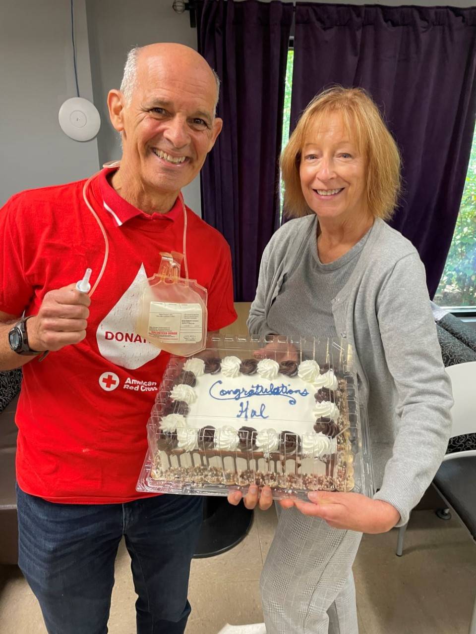 Hal and Alison Schlenger celebrate Hal’s milestone of donating 20 gallons of blood to the American Red Cross.