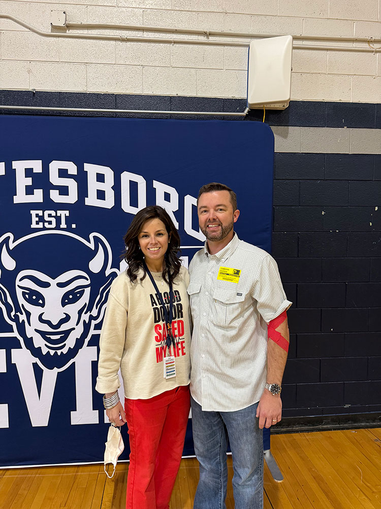 Hope Hall standing next to her brother Cameron Durden, after he donated blood.