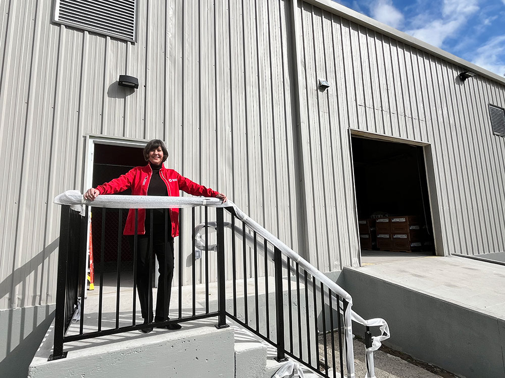 Maria Center, Executive Director of the Southeast Georgia Chapter, stands in front of the new Red Cross operations center.