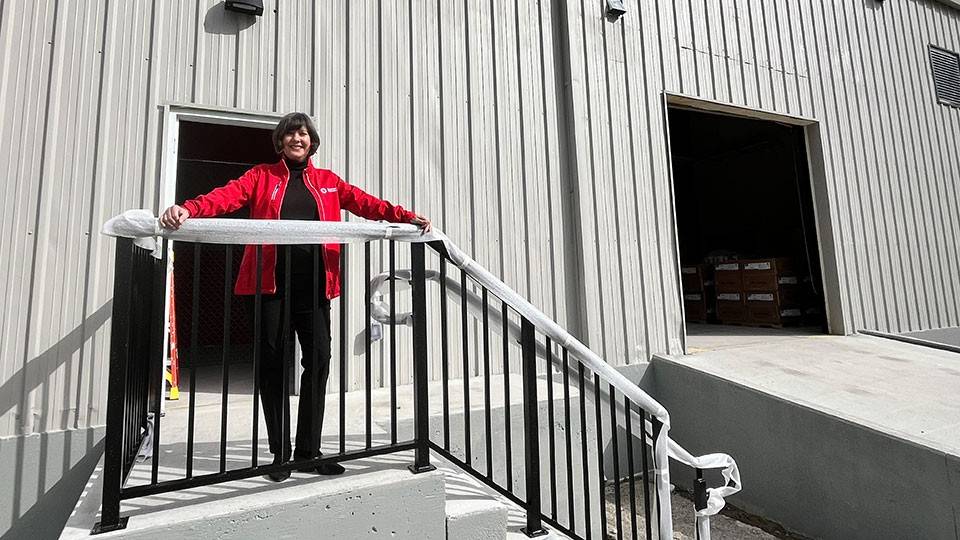 Maria Center, Executive Director of the Southeast Georgia Chapter, stands in front of the new Red Cross operations center.