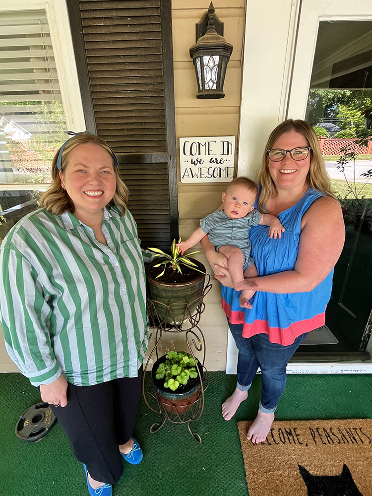 Holly Long, Morgan Cantrell, and Morgan's baby smiling for picture.