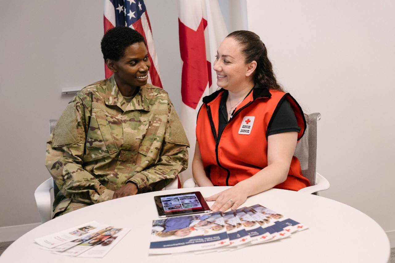 June 21, 2018. Washington, DC. Development SAF Stock Photography Project 2018.Veteran Melissa Duffley has volunteered with different Lines of Service for the American Red Cross, but has recently become more involved with the Service to Armed Forces, due to her personal connection. She believes the work she does is important because "these soldiers need a little comfort, they're dealing with a lot. They're struggling maybe with PTSD, injuries, being separated from their families." In addition to helping soldiers and veterans, she enjoys helping military families, especially children. " I helped with a children's resiliency training program. We were in a group with teenagers who talked about what was going on with them." Her experiences, thus far have already showcased the good SAF and the American Red Cross can accomplish. She urges others to give back and ease the pain of others, too "any little bit helps. There's always an opportunity to fill any type of void and give your time."Photo by Roy Cox/American Red Cross
