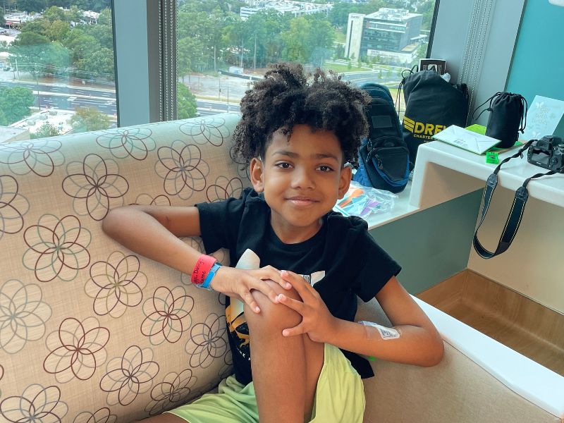 grayson sitting in front of window