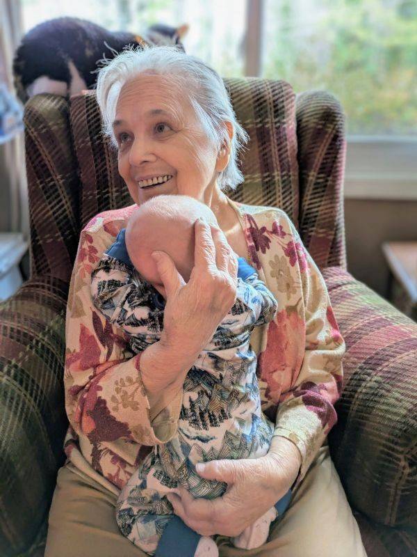 grandmother embracing grandchild