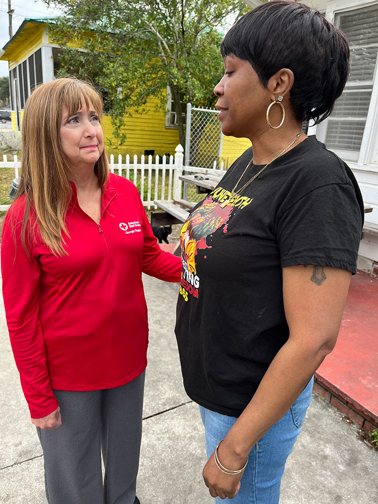 Red Cross Executive Director Jackie Shoemaker and homeowner Tangula Mitchell standing next to each other.