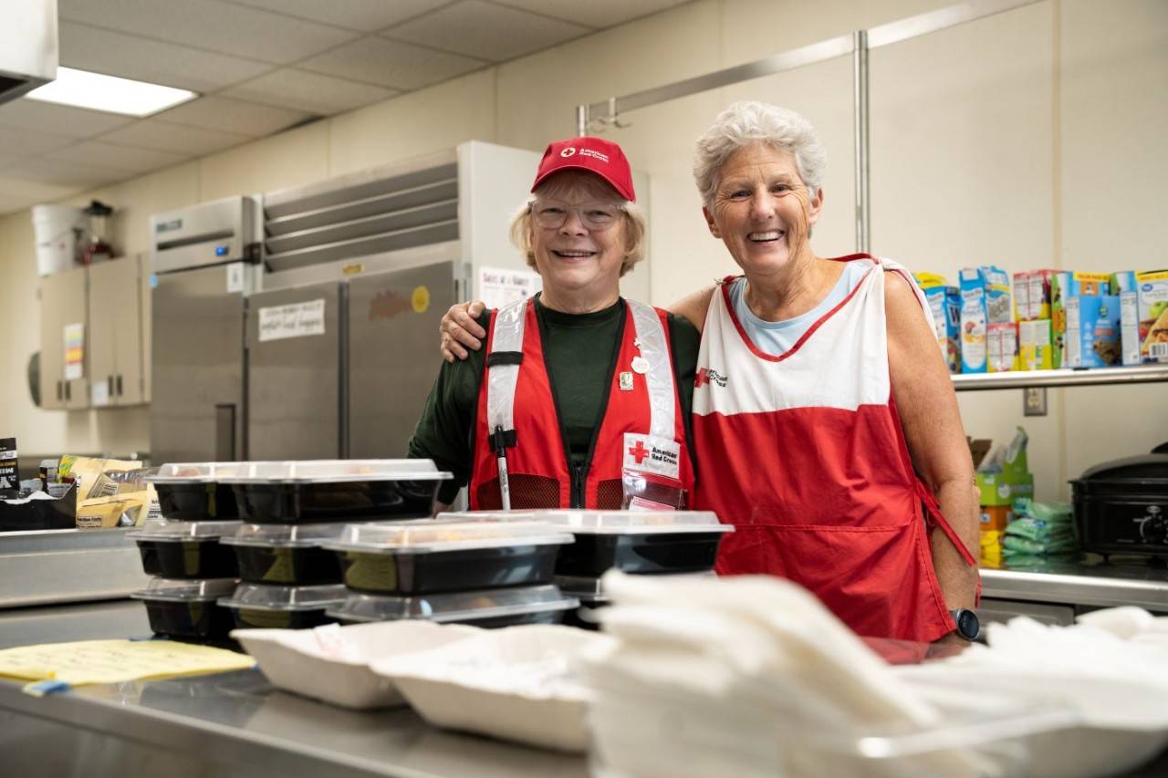 American Red Cross volunteers serve food in the shelter at Kettle Falls Middle School