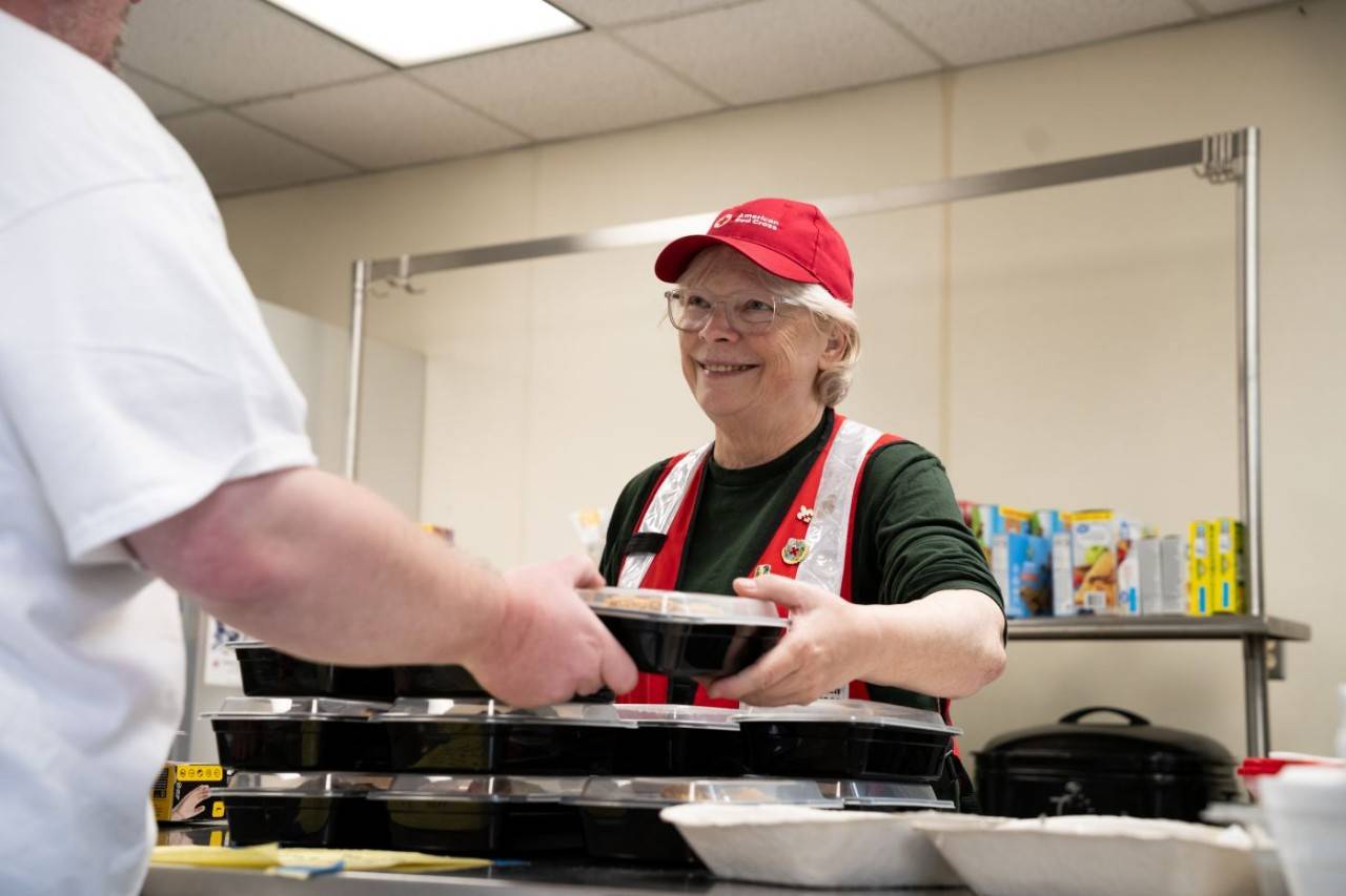 American Red Cross volunteers serve food in the shelter at Kettle Falls Middle School